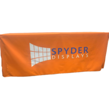 an orange fired tablecloth with a spider displays logo